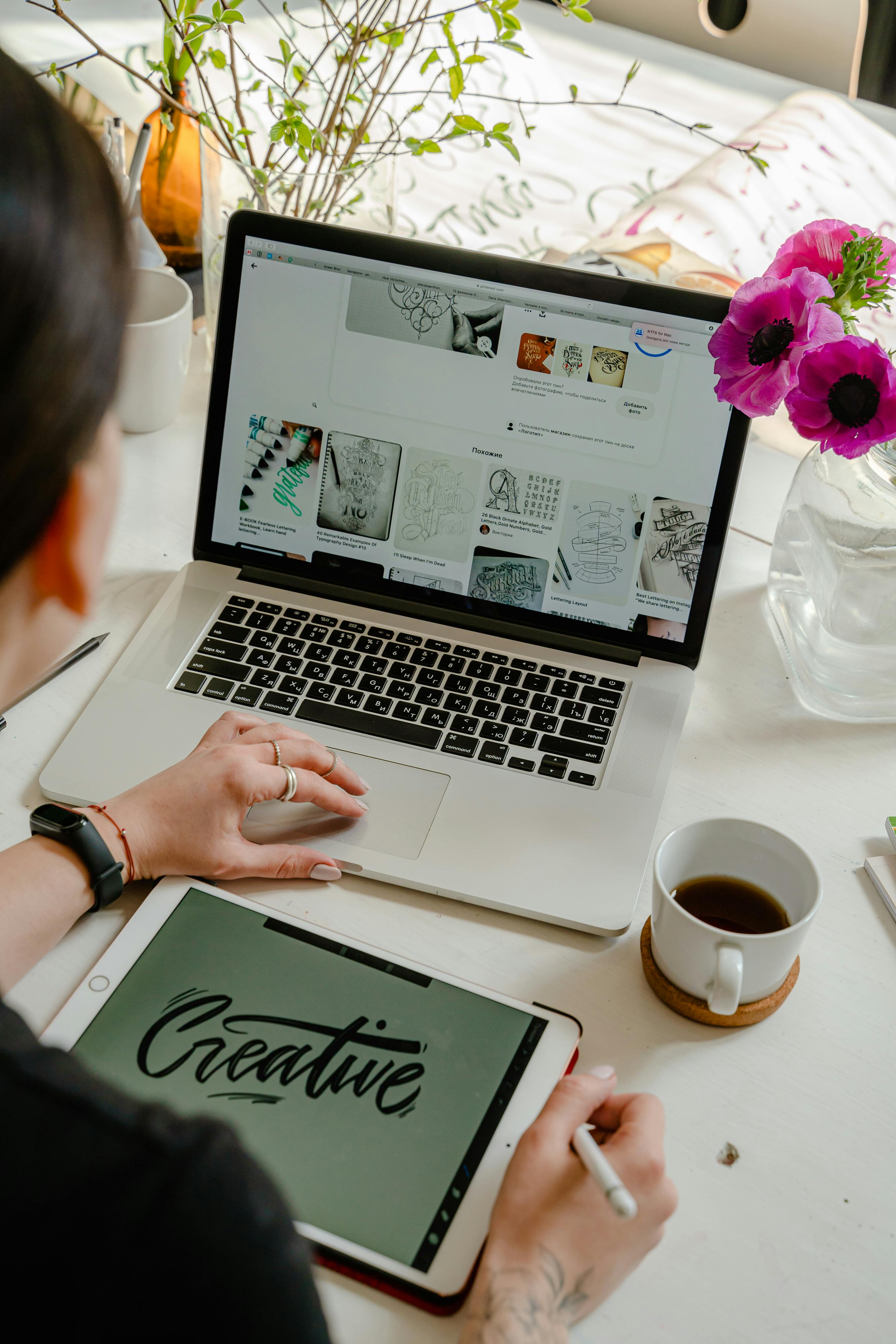 Creative workspace with content planning calendar on a laptop, representing a publisher mindset in brand content strategy.